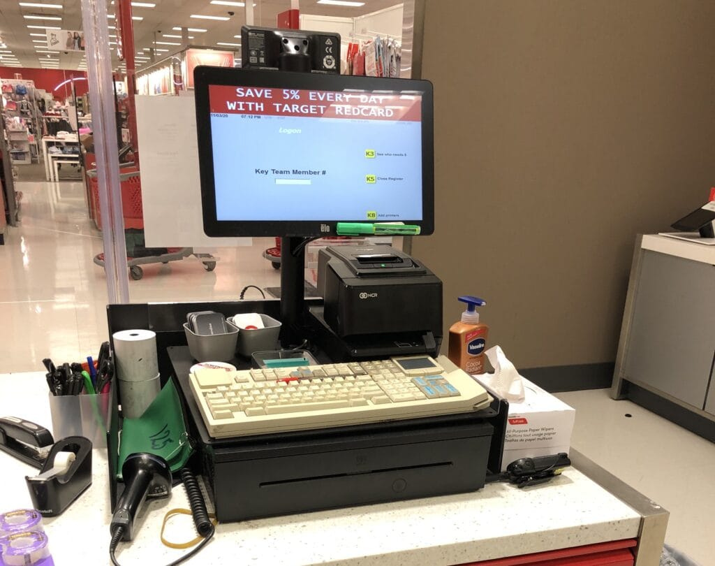 Target register at a team member login screen with receipt printer and cash drawer